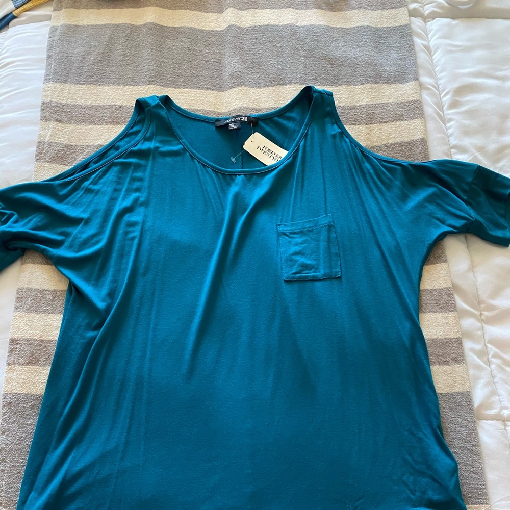 Teal shirt with open shoulder